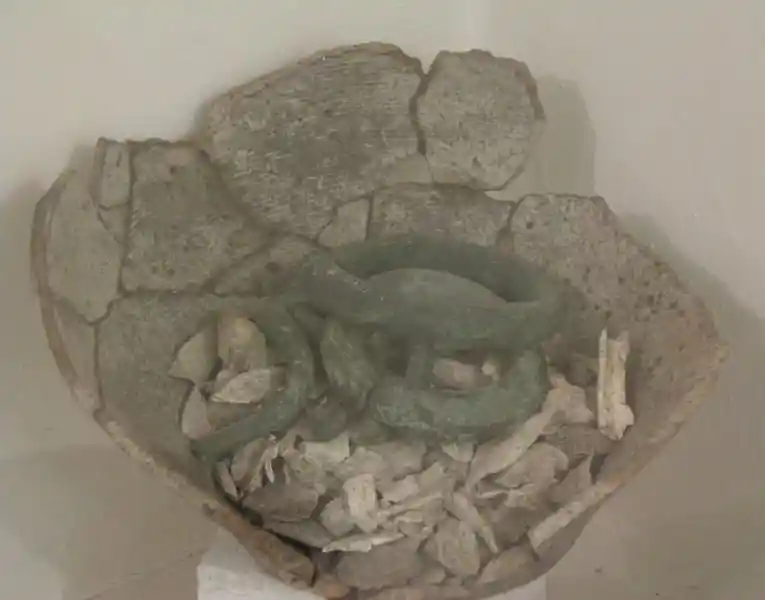 Broken vase, bracelet-looking artifacts